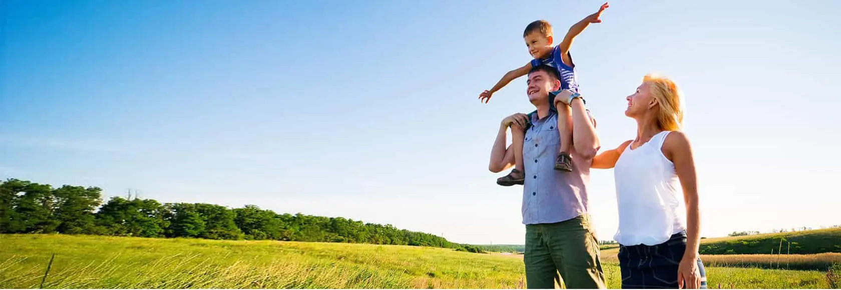 A man holding his son on top of him.