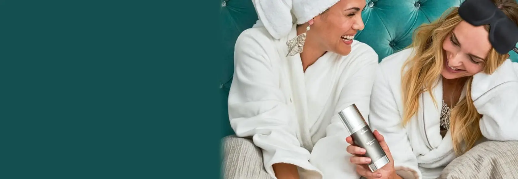 A woman in white bathrobe holding a cup.