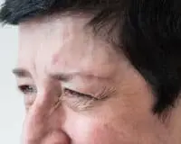 A close up of the eyes and brows of an older person