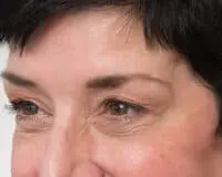 A close up of the eyes and face of a woman.