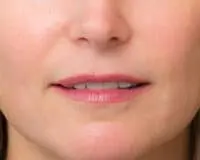 A close up of the lips and chin of a woman