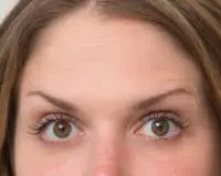 A woman 's eyes are shown with brown color.