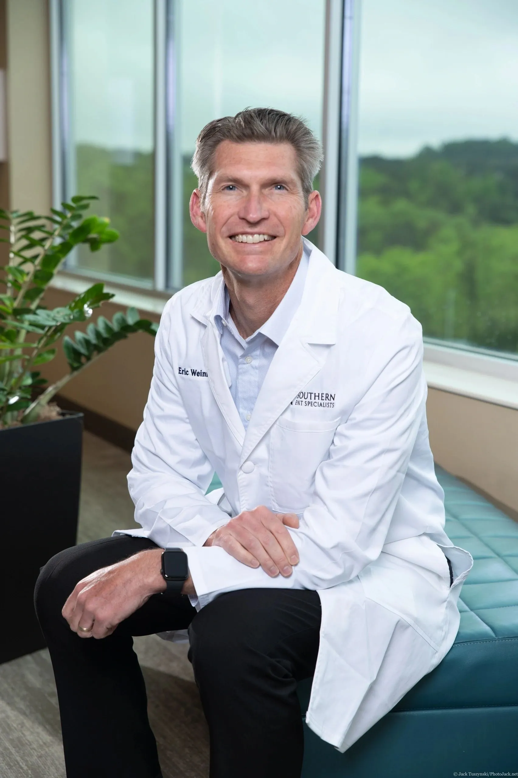 A white background with a black and white logo